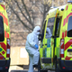 A health care worker getting into an ambulance at St Thomas’ Hospital in London on March 24, 2020.
